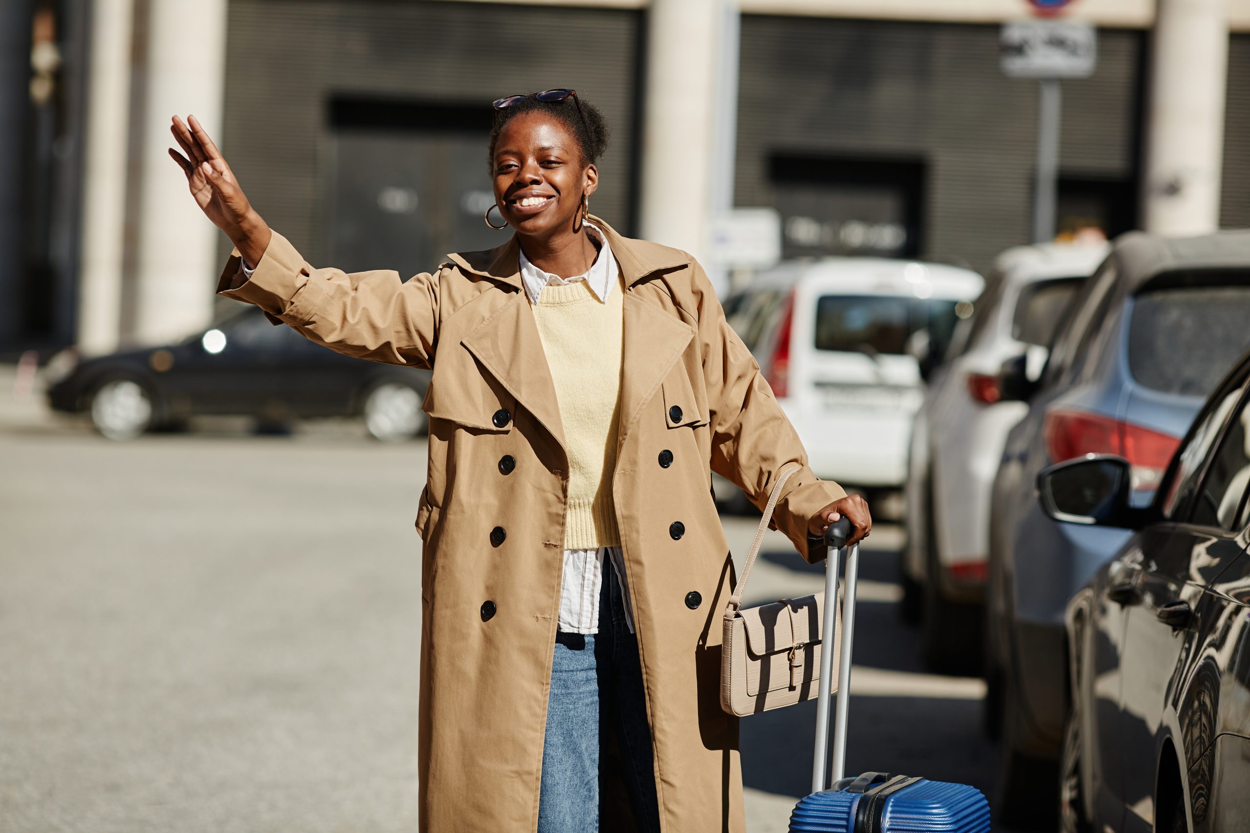 black-young-woman-hailing-cab-2023-11-27-05-30-39-utc