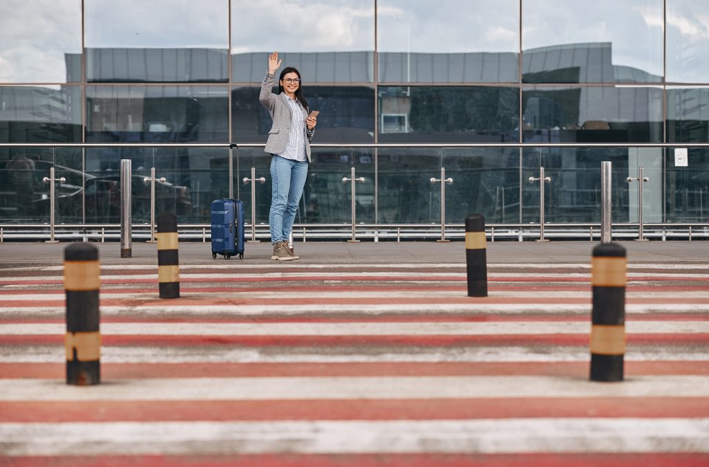 happy-caucasian-woman-traveller-in-airport-termina-2023-11-27-05-23-26-utc